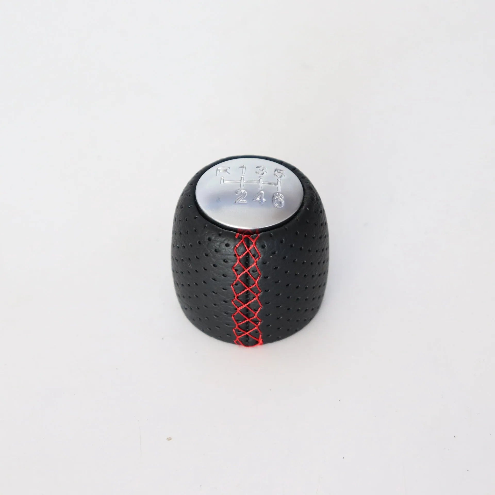 Sewn wrapped leather perforated style handball gear knob for Alpha vehicles in black, red, and white colour options.