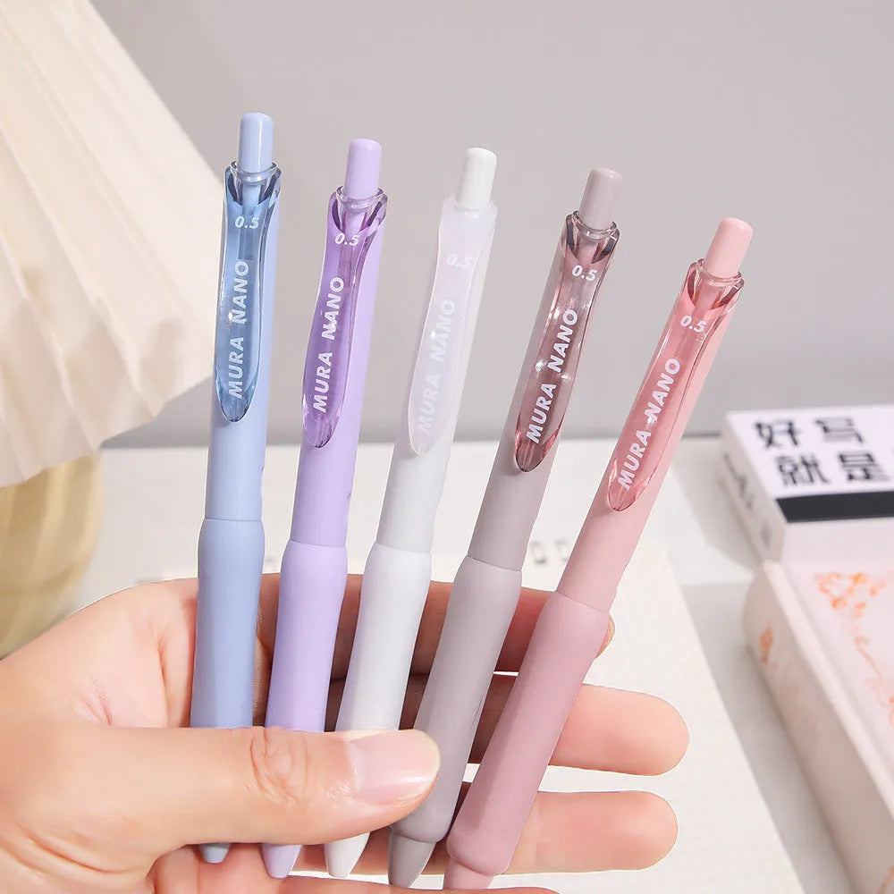 Macaron colour press gel pen with 0.5mm tip shown in smoked brown, powder, and white refill options.