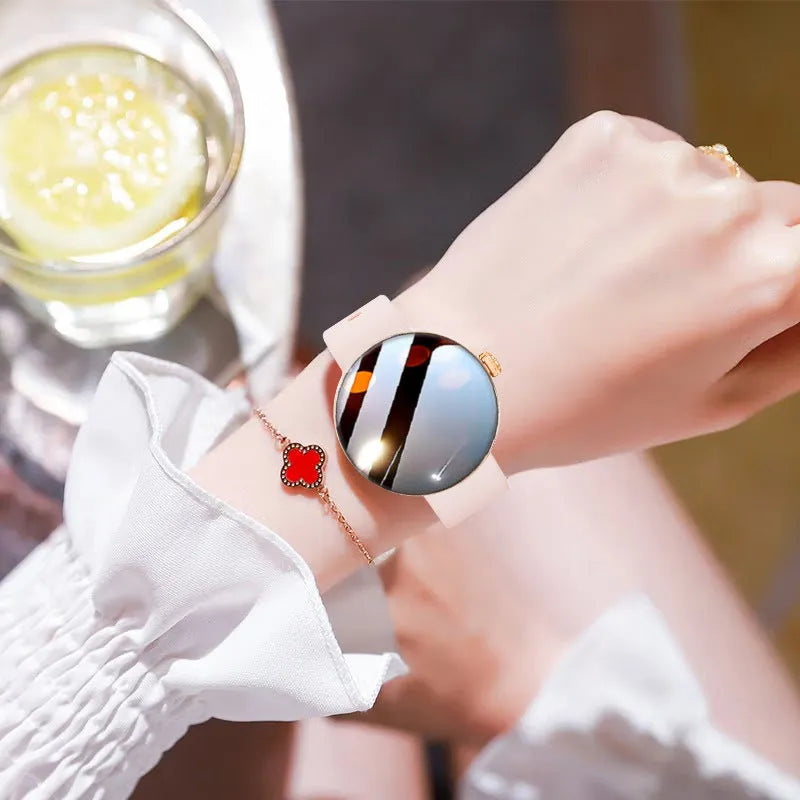 Women's smart watch with circular colour touch screen and metal strap in black, gold, or silver steel.