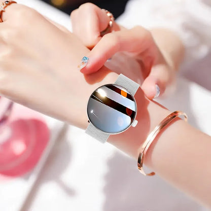 Women's smart watch with circular colour touch screen and metal strap in black, gold, or silver steel.