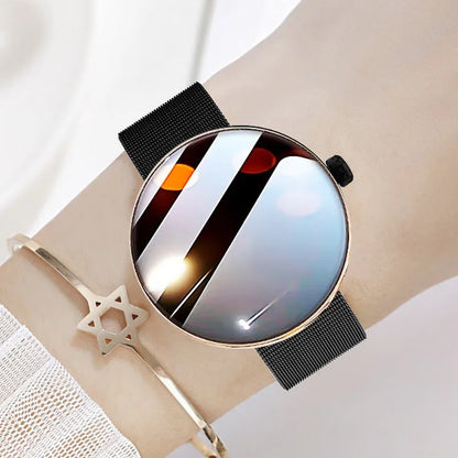 Women's smart watch with circular colour touch screen and metal strap in black, gold, or silver steel.
