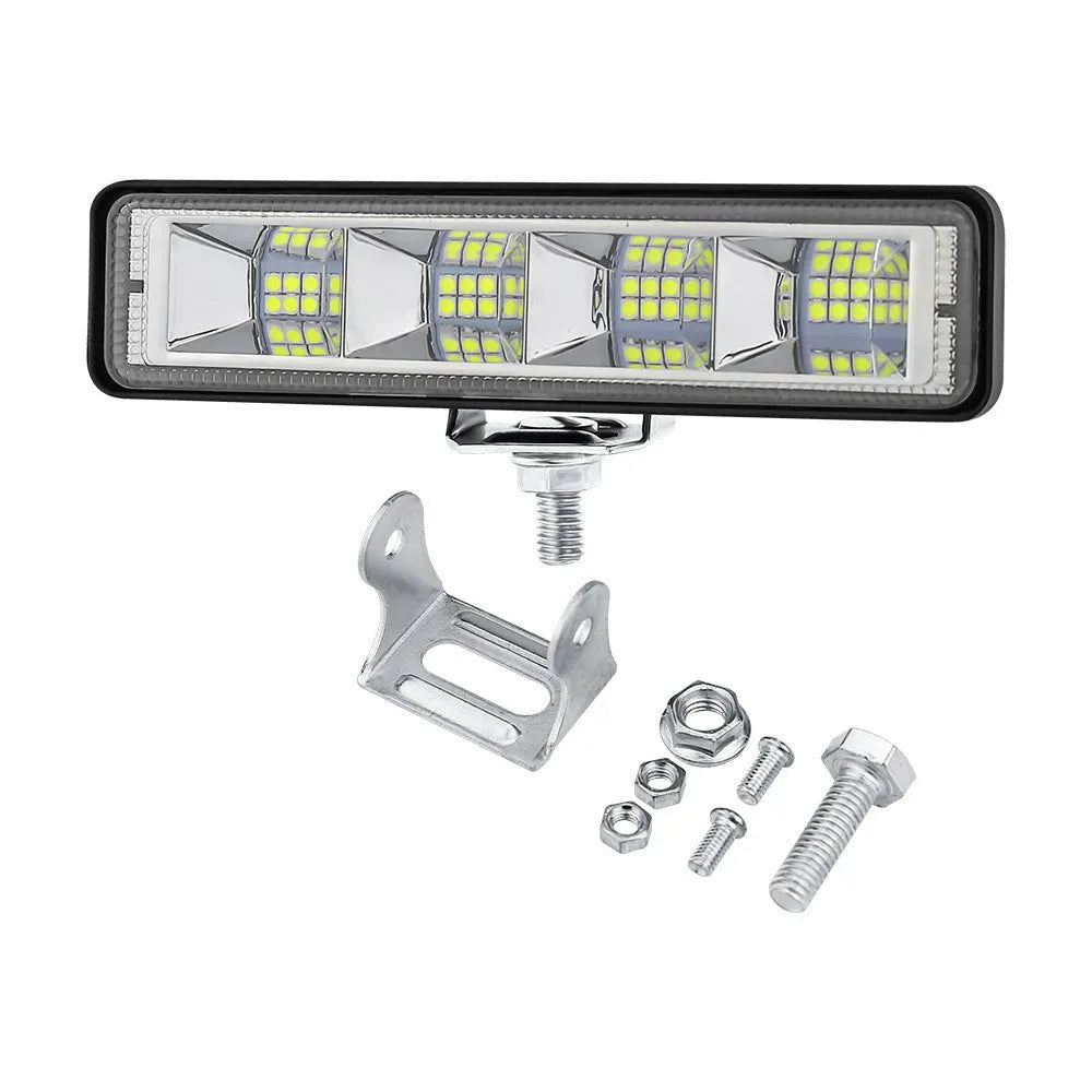 Four compact aluminium LED work lights in work light white colour, suitable for vehicle mounting.