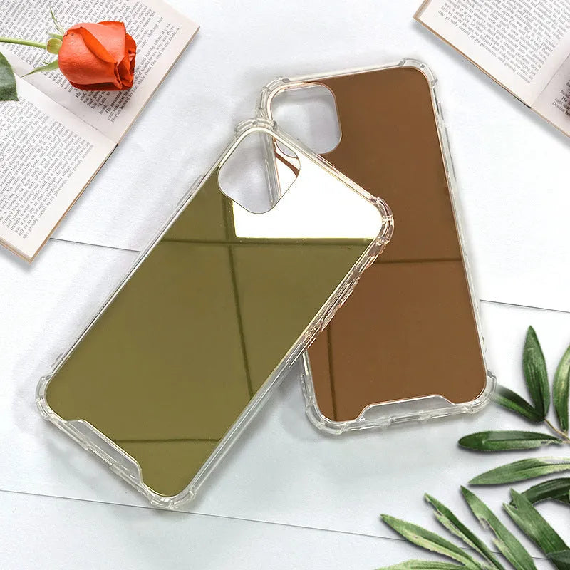 Silver mirrored phone case for Apple iPhone on a table, showing reflective back.