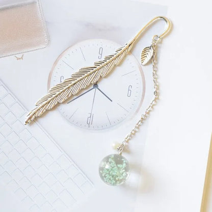 Dried flower bookmark with alloy frame measuring 12cm by 2cm, showing preserved botanical specimens