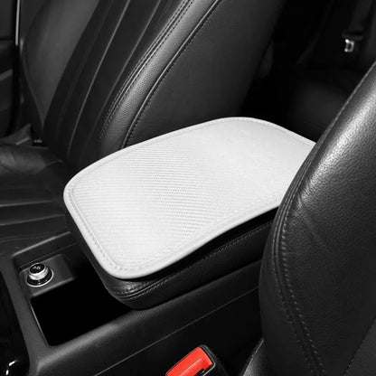 Leather automotive armrest box mat for car centre console protection.