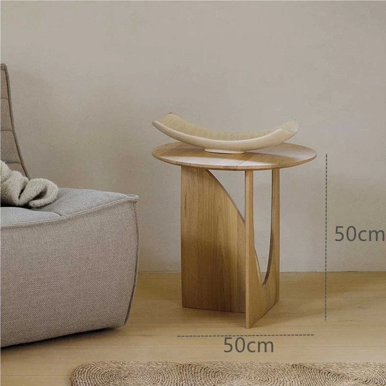Round solid wood bedside table with geometric legs in walnut finish measuring 50cm diameter