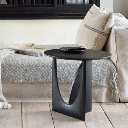 Round solid wood bedside table with geometric legs in walnut finish measuring 50cm diameter