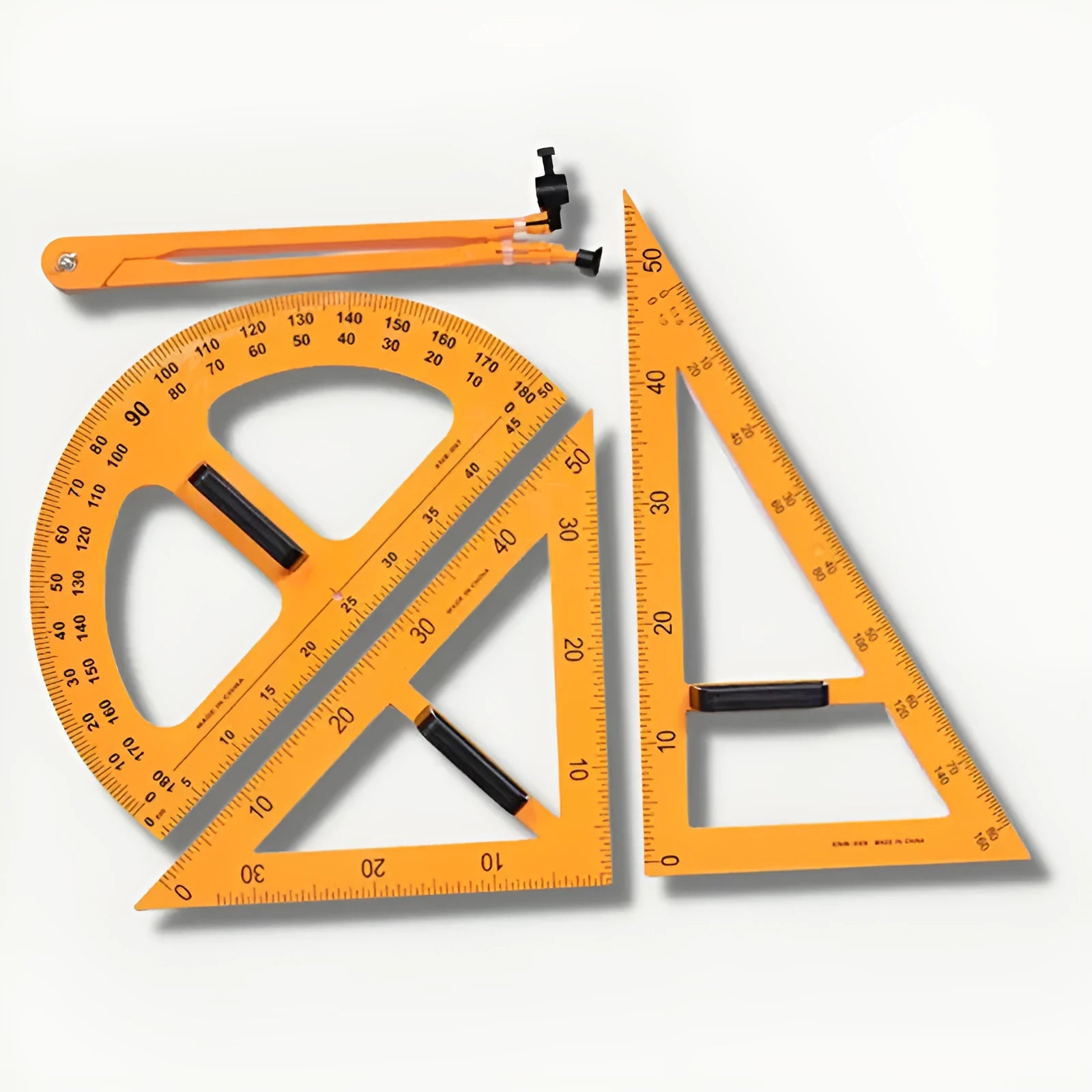 Orange and black mathematics teaching tools set with triangle rulers, protractor and chalk compass