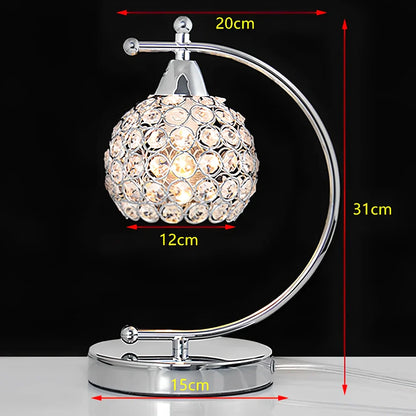 Crystal table lamp with chrome iron body measuring 31cm height