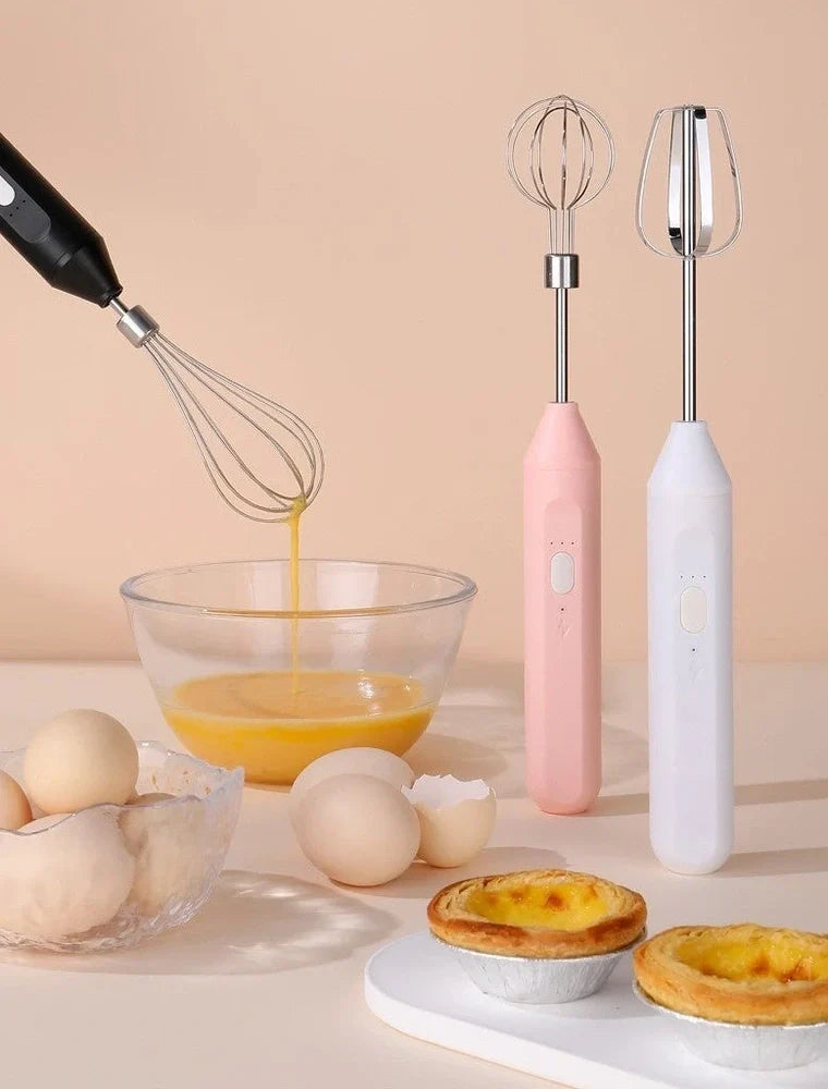 Black handheld electric egg beater with stainless steel beaters and 3-speed control buttons