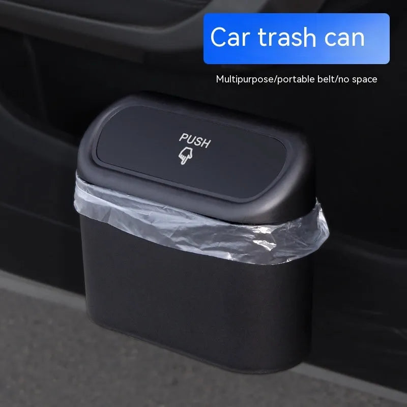 Black folding car trash can with handle mounted on vehicle seat