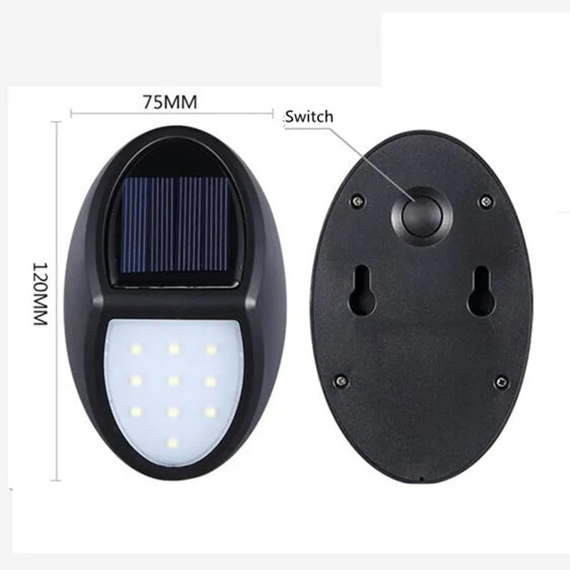Black rectangular LED solar wall light with solar panel on top for outdoor security.