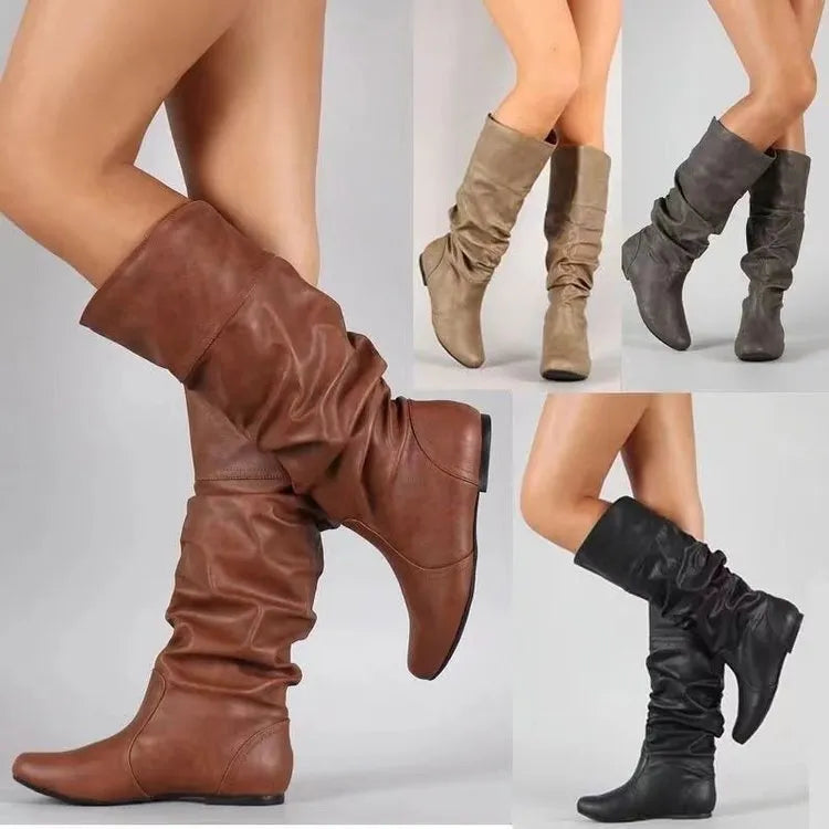Women's flat heel long boots in black, slip-on style with a high cylinder shaft and rubber sole.