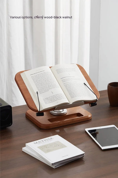 Walnut coloured solid wood adjustable reading rack with rotating base holding a book