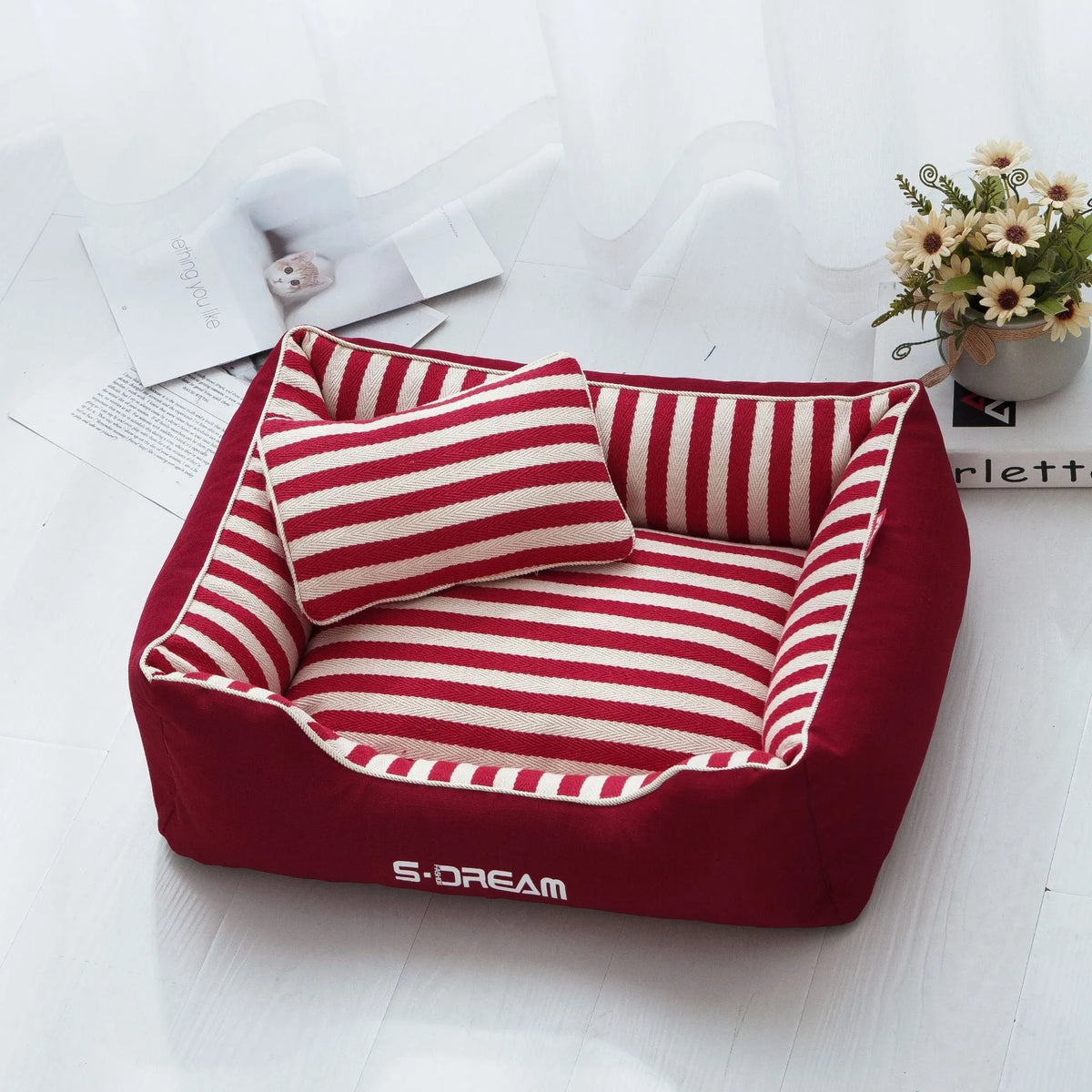 Removable washable dog kennel mat with fabric pillow in navy stripes and blue or red colour options.