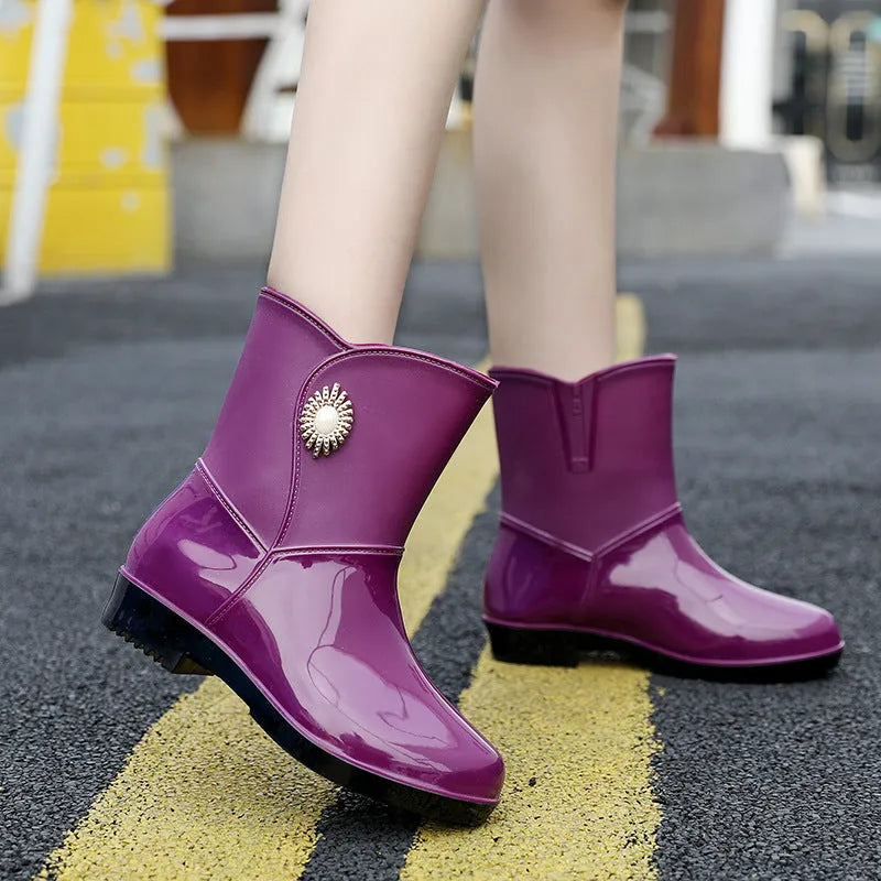 Women's mid-calf rain boots in beige, black, or purple with a non-slip sole.