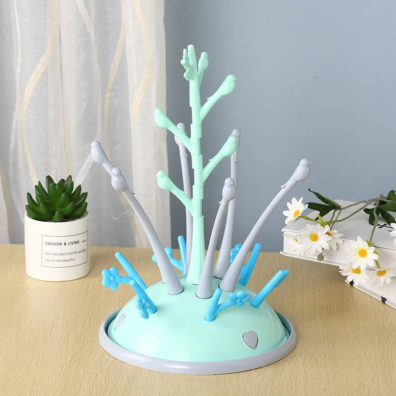 Portable baby bottle drying rack in green and purple, made from safety PP material