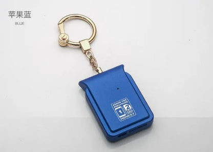 Black leather Bluetooth Dual SIM Adapter keychain with Nano SIM slot and Micro USB port.