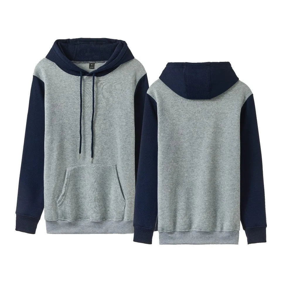 Man wearing a white loose fleece-lined hoodie with contrast stitching, showing the pullover style and hood.