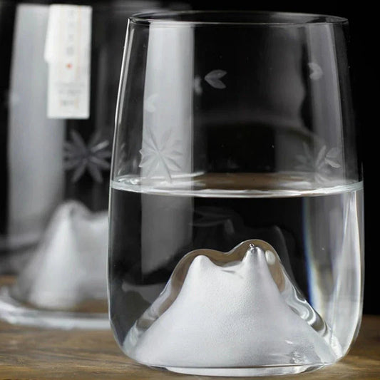 Elegant Japanese crystal glass tumbler with intricate cherry blossom design, perfect for enjoying whisky, spirits, and cocktails