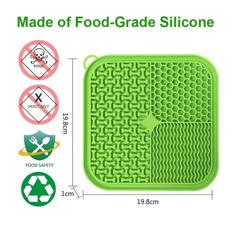Square orange, grey, blue, and green silicone dog licking mat with suction cups on the base.