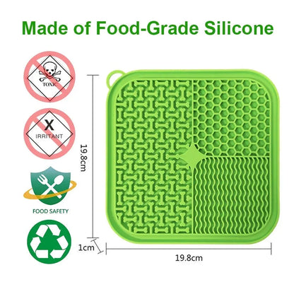 Square orange, grey, blue, and green silicone dog licking mat with suction cups on the base.