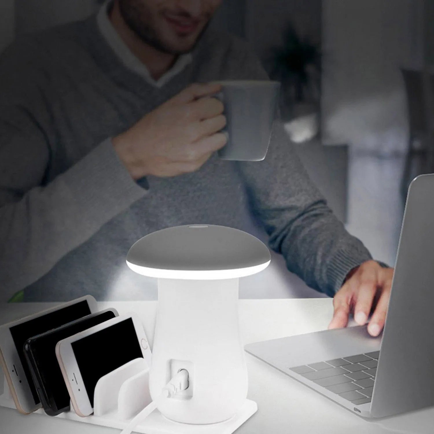 White mushroom-shaped USB charging dock station with 5 ports and an illuminated LED night light on a wooden desk.