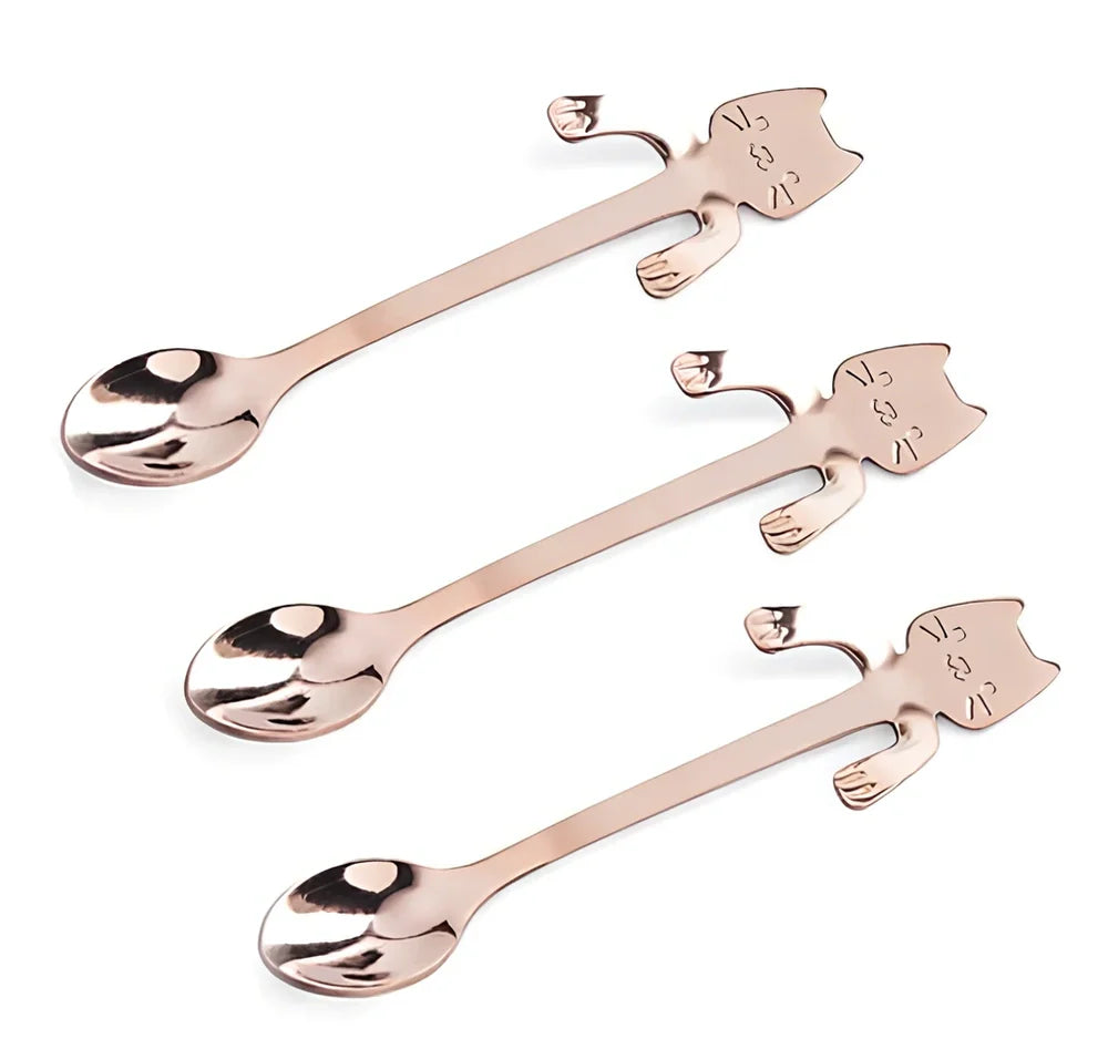 Stainless steel coffee spoon with cartoon cat handle showing hanging hole and smooth edges