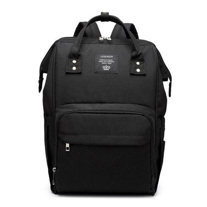 Stylish maternity diaper bag in various colors, featuring a paper bag design, separate bottle compartment, and discreet breastfeeding button.