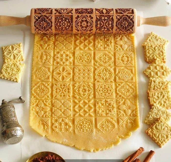 Festive rolling pin with embossed Christmas designs for easy imprinting on dough