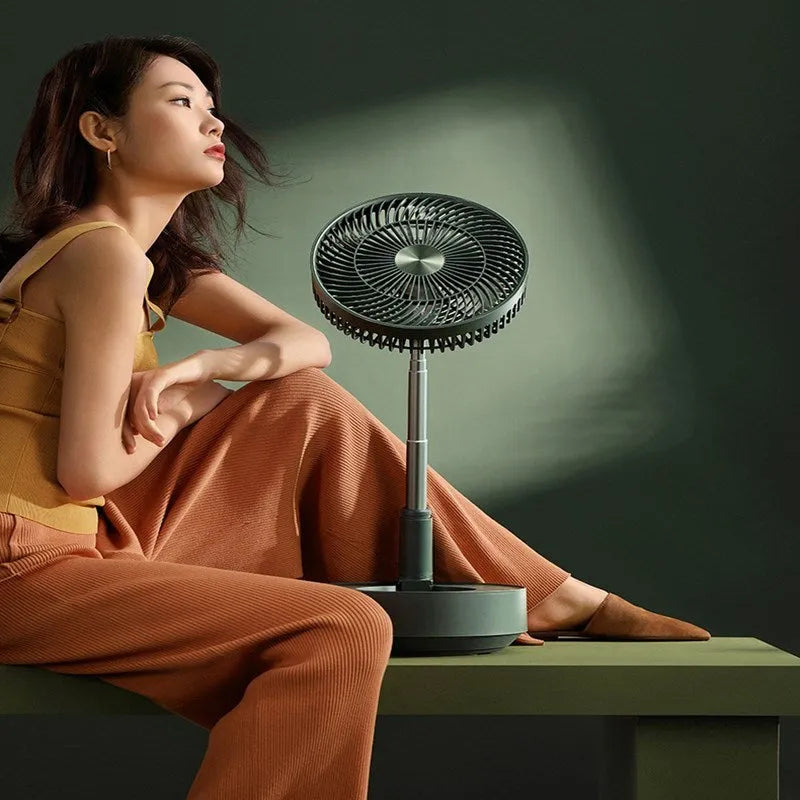 Green rechargeable floor fan with humidifier in extended position showing telescopic design