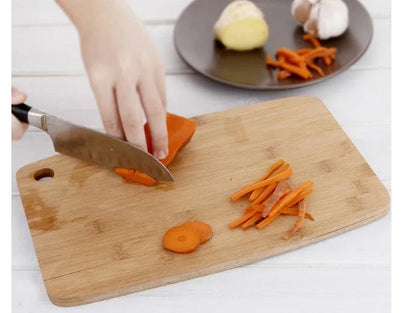 Square Moso bamboo kitchen cutting board with antibacterial protection, 28cm by 17cm