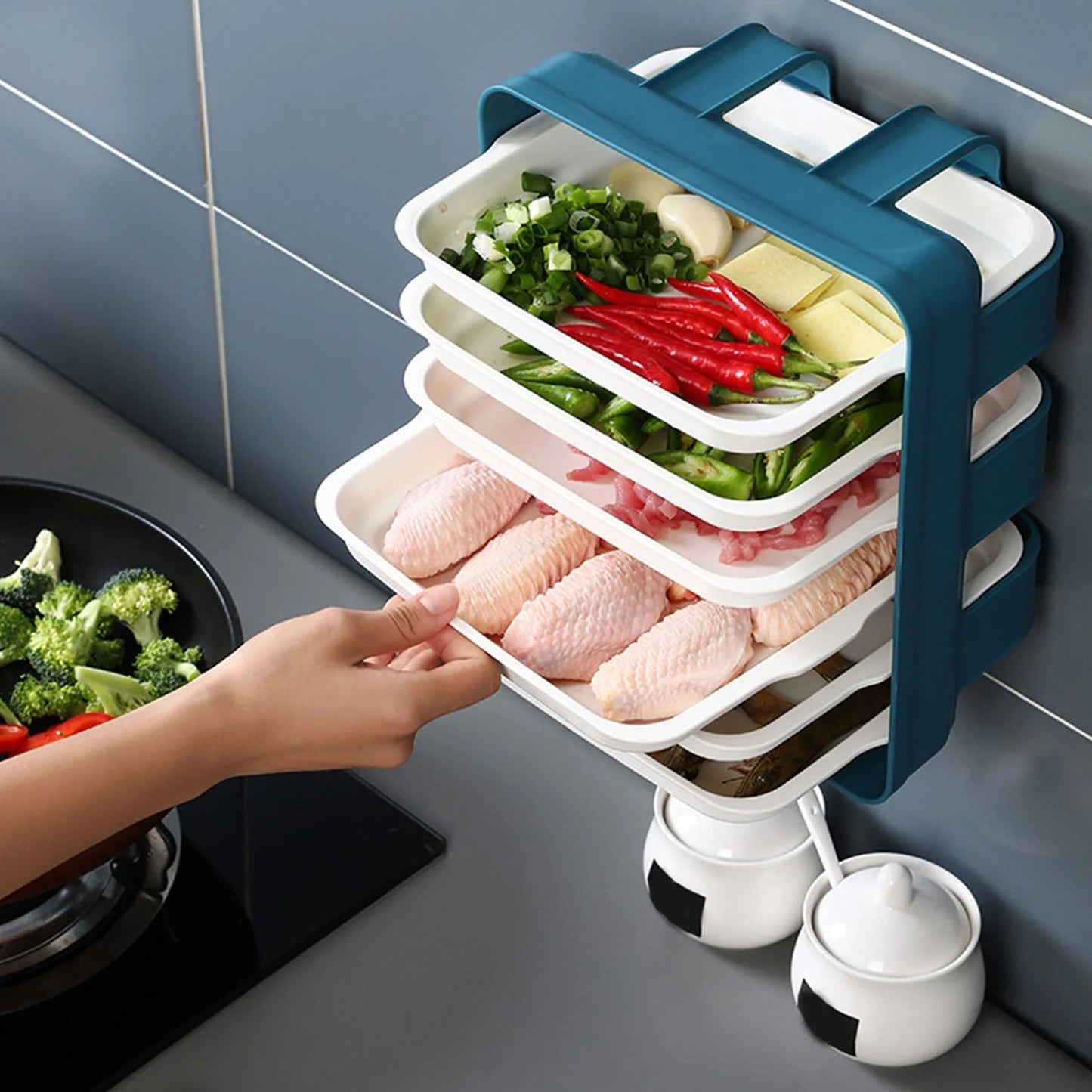 Wall-mounted kitchen shelf with stackable trays in navy blue, white, and coffee colour options