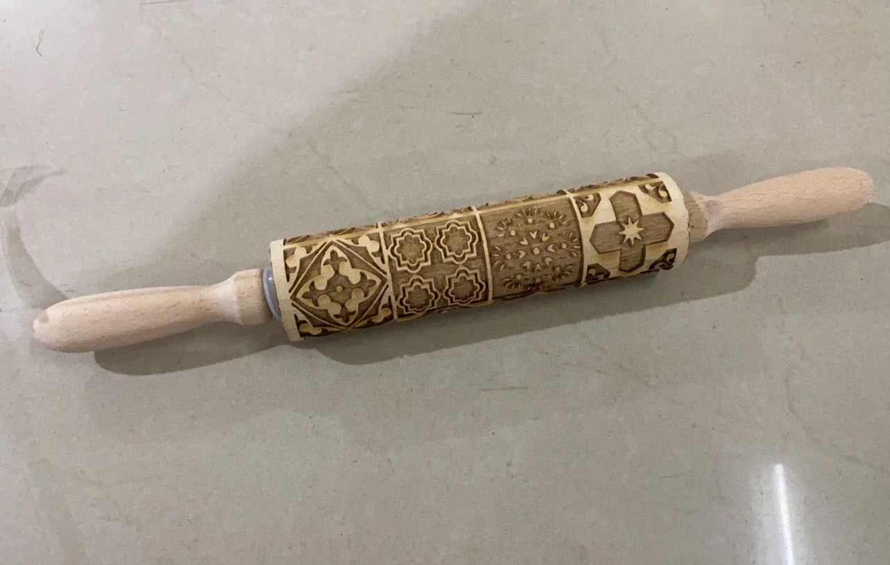 Festive rolling pin with embossed Christmas designs for easy imprinting on dough
