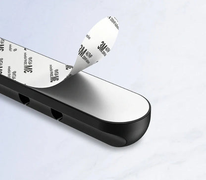 Black silicone USB cable winder for desktop cable management