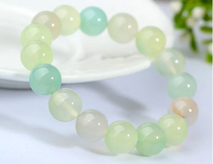 Handcrafted beaded bracelet with seven chakra-representing beads, designed to promote balance and well-being.