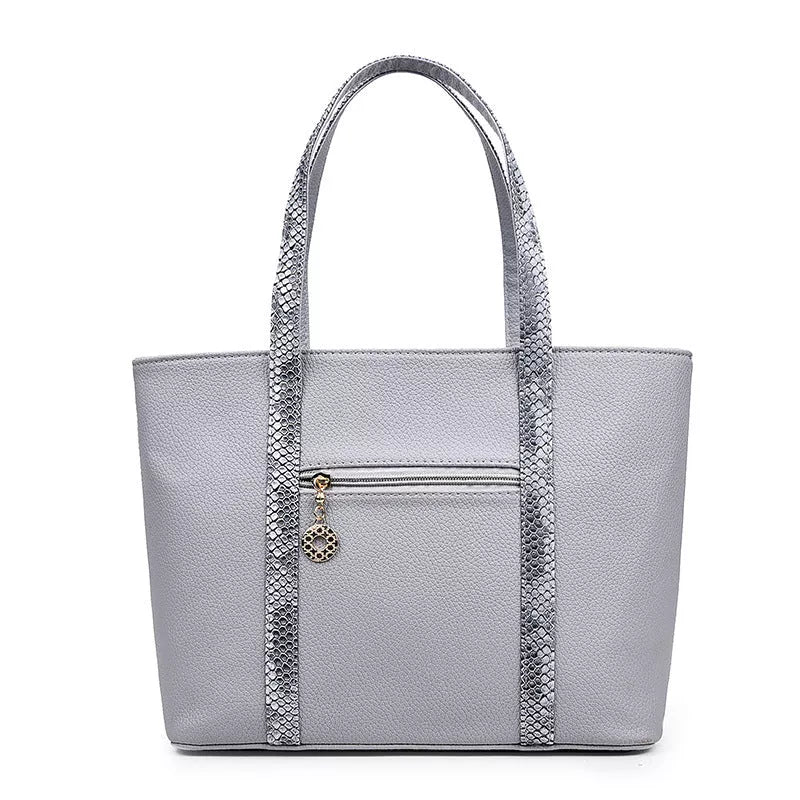 Women's shoulder bag with zipper closure and multiple pockets in light grey, black, off-white, and rose red