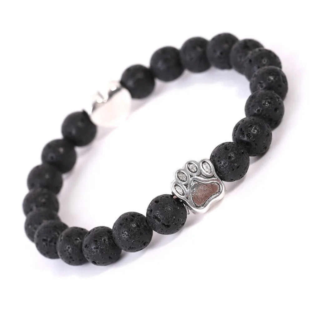 Tiger's eye stone bracelet with dog paw and Indian agate beaded designs on a wrist.