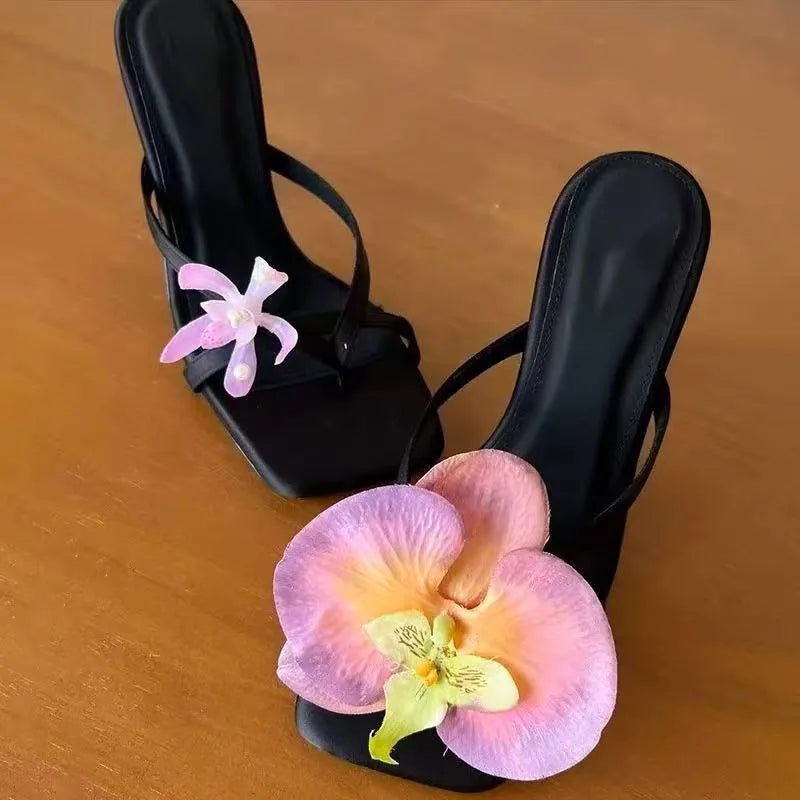 Women's handmade asymmetric flower sandals high heel semi-slipper featuring a calf leather upper, EVA sole, and square head scaffolding shape in black, green, pink, or white available in sizes 35 to 40 with a microfiber lining for comfortable wear