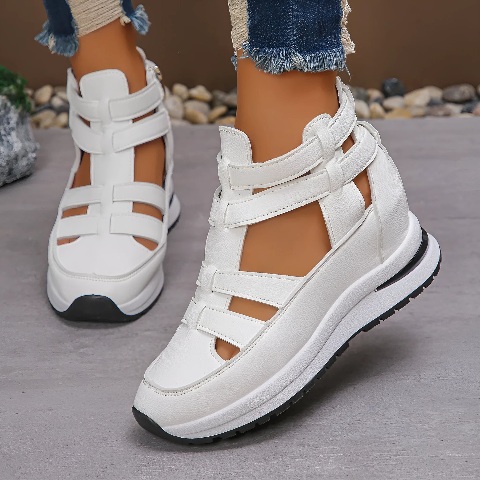 Black women's close-toed platform sandals with hollow-out design and Velcro strap.