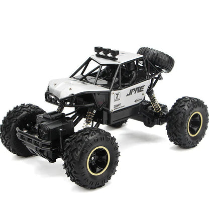 Four-wheel drive remote control car with 2.4G wireless controller on rough terrain