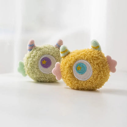 Plush cartoon dog chew toy with large eyes and squeaker in grey, green, pink, white or yellow