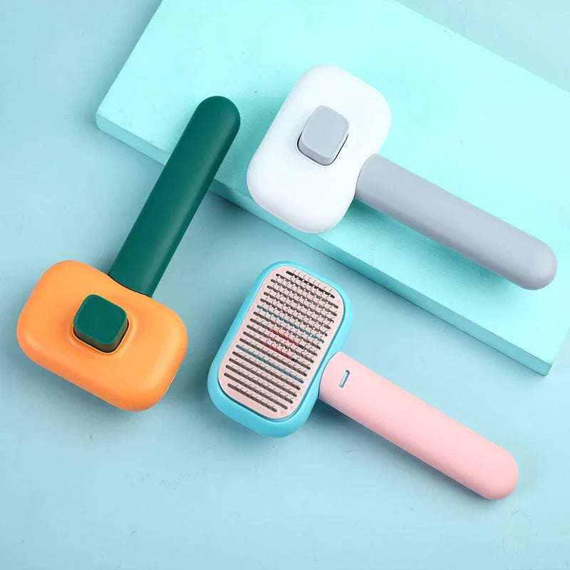Premium pet hair brush and massage comb for cats and dogs in grey, pink, and green colors