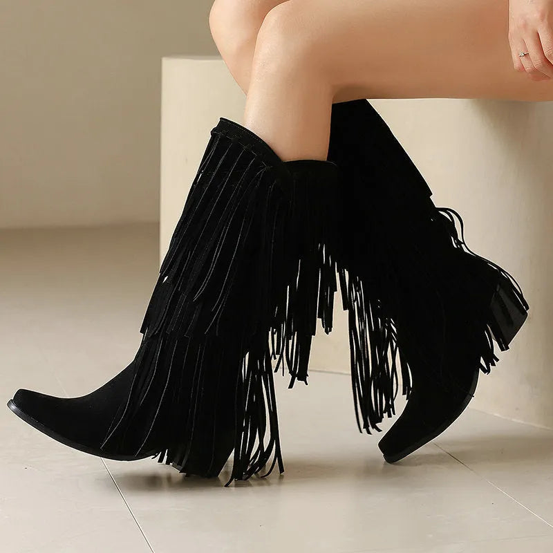 Women's black suede high boots with tassel detail, chunky heel, and square toe.