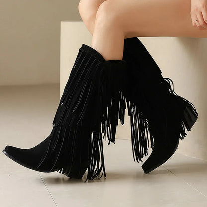 Women's black suede high boots with tassel detail, chunky heel, and square toe.
