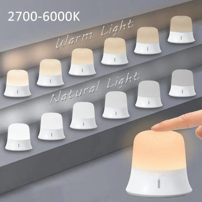 White rechargeable bedside night light with touch controls showing dimming and colour options