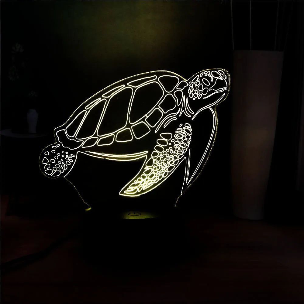3D acrylic turtle-shaped LED night light showing one of its 16 colour options on a bedroom shelf.