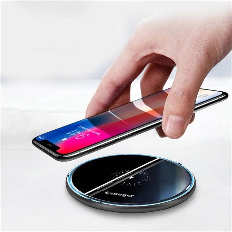 Black wireless charging pad with LED indicator light, measuring 10.1 by 7 centimetres