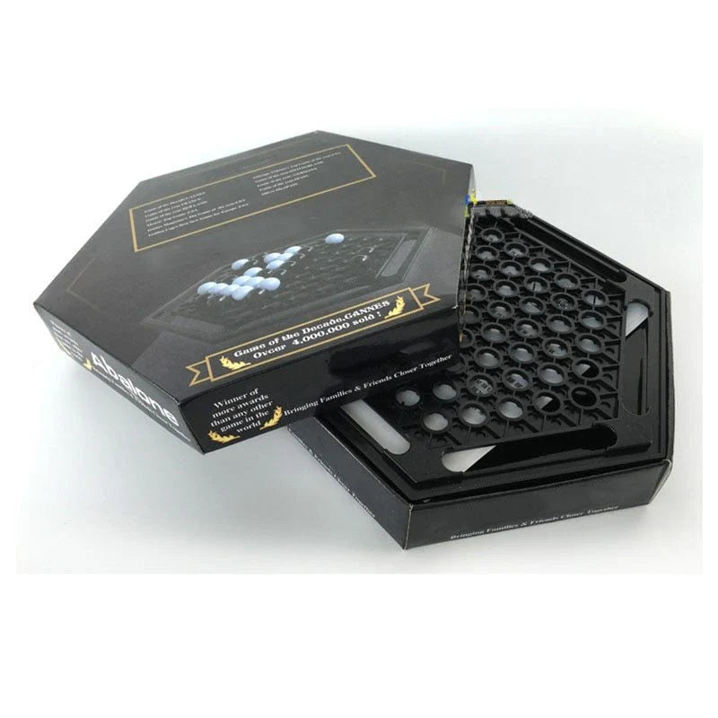 Abalone family board game with marble pieces on a wooden game board
