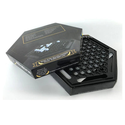 Abalone family board game with marble pieces on a wooden game board